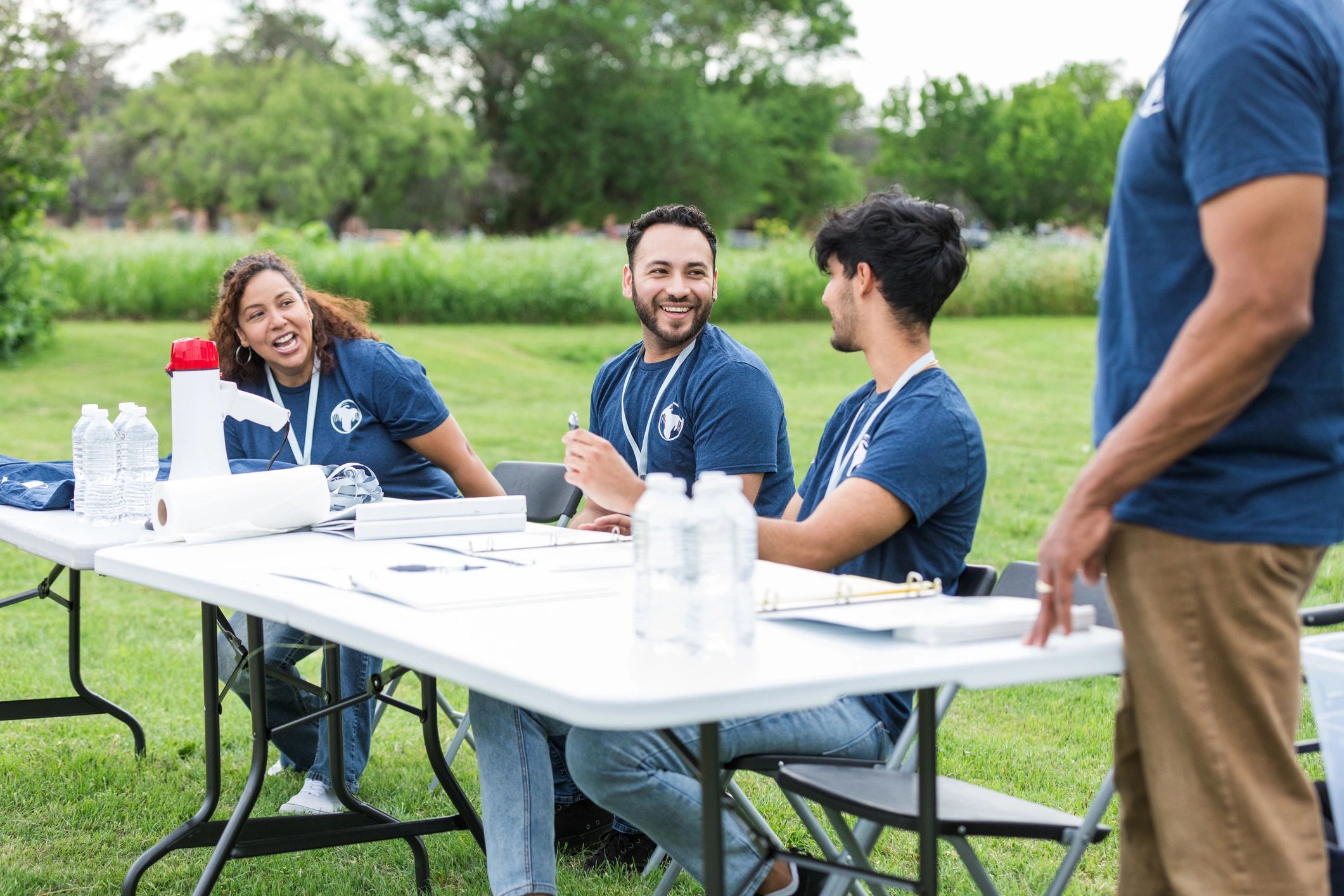 Volunteers working together at an event registration table
