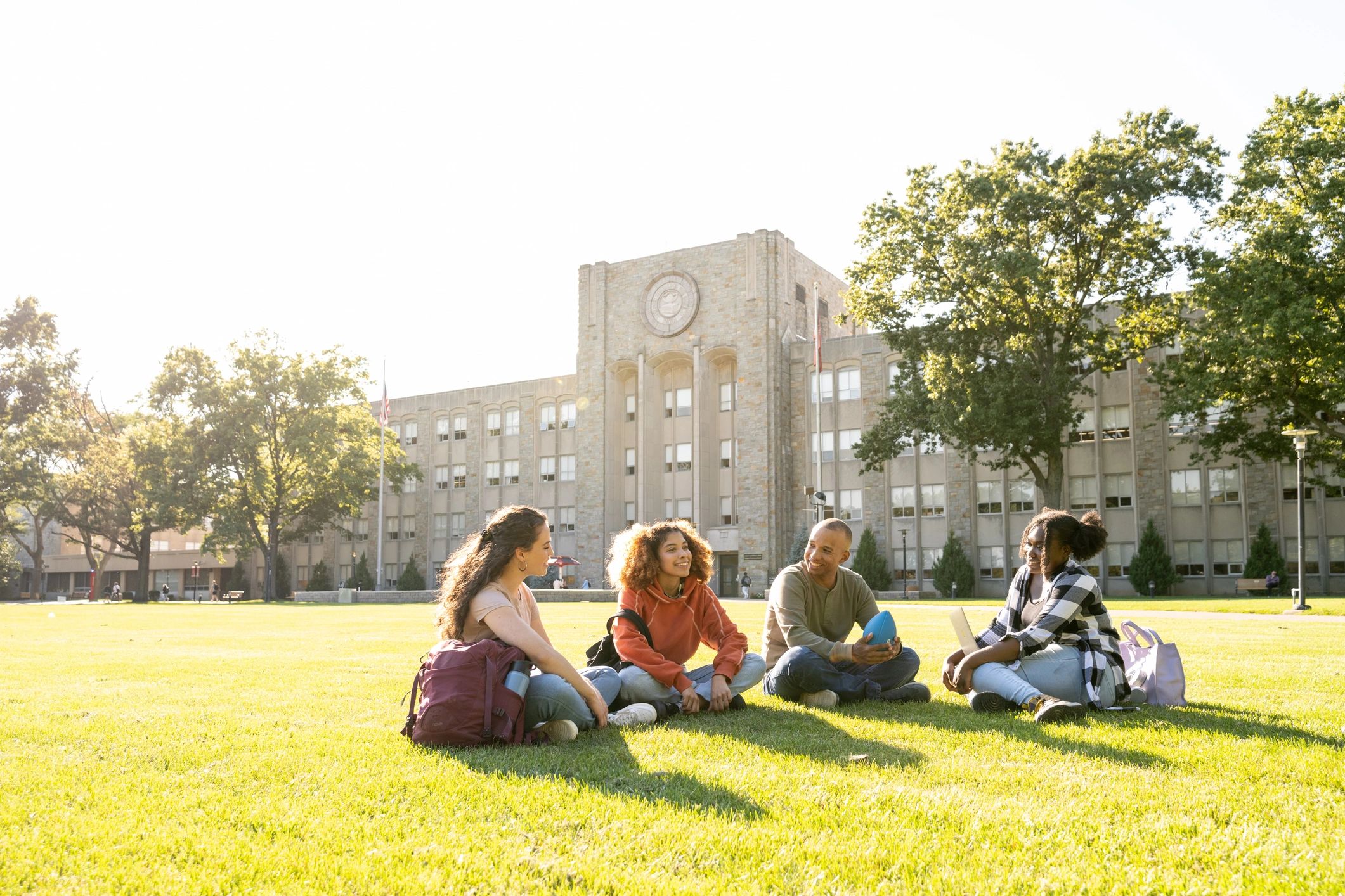 College students gathered outdoors on campus
